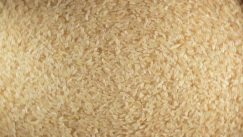 Uncooked Long Grain Parboiled Rice, Rotating Background - Top View Stock Footage 178615946