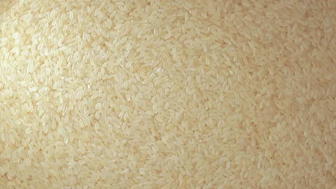 Uncooked Long Grain Parboiled Rice, Rotating Background - Top View Stock Footage 201384913