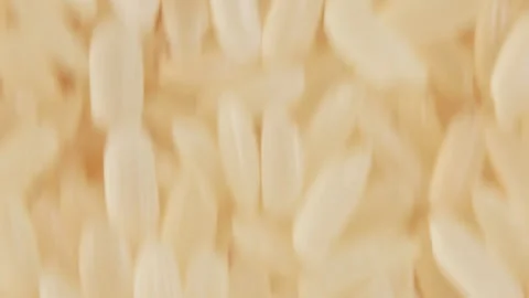 Uncooked Long Grain Parboiled Rice, Moving Background - Top View Stock Footage 203801484