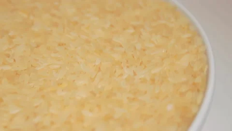 Uncooked Long Grain Parboiled Rice Rotating Stock Footage 220211429
