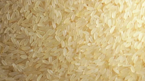 Uncooked Long Grain Parboiled Rice, Rotating Background - Top View Stock Footage 220315341