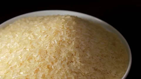 Uncooked Long Grain Parboiled Rice Rotating Stock Footage 224552501