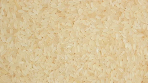 Uncooked Long Grain Parboiled Rice, Rotating Background - Top View Stock Footage 224656570