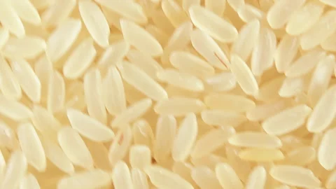 Uncooked Long Grain Parboiled Rice, Rotating Background - Top View Stock Footage 243132011