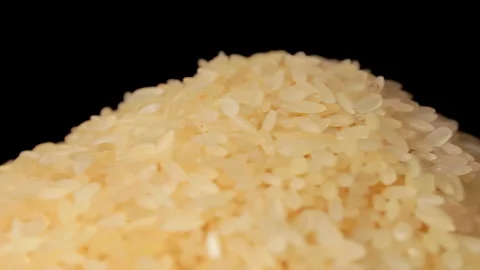Uncooked Long Grain Parboiled Rice Rotating Stock Footage 245295916