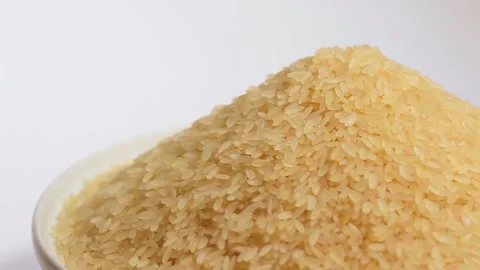 Uncooked Long Grain Parboiled Rice Rotating Stock Footage 246878686