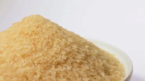 Uncooked Long Grain Parboiled Rice Rotating Stock Footage 250794485