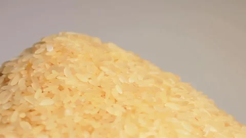 Uncooked Long Grain Parboiled Rice Rotating Stock Footage 252106975