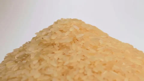 Uncooked Long Grain Parboiled Rice Rotating Stock Footage 252109310