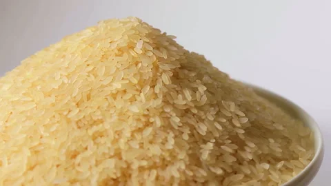 Uncooked Long Grain Parboiled Rice Rotating Stock Footage 253487746