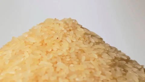 Uncooked Long Grain Parboiled Rice Rotating Stock Footage 253569622