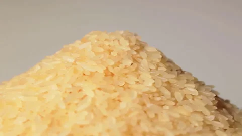 Uncooked Long Grain Parboiled Rice Rotating Stock Footage 253658189