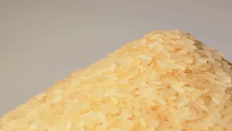 Uncooked Long Grain Parboiled Rice Rotating Stock Footage 255475754