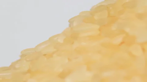 Uncooked Long Grain Parboiled Rice Rotating - Macro Stock Footage 258893590