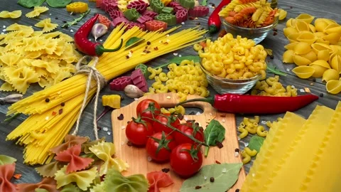 Uncooked macaroni and pasta on table Stock Footage 151218820