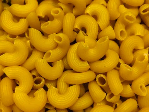 Uncooked macaroni Stock Photos
