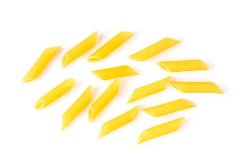 Uncooked macaroni on a white background Stock Photos