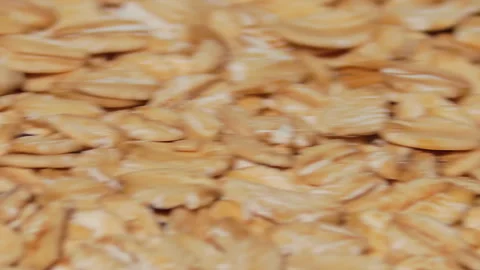 Uncooked Oat Flakes Rotating - Macro Stock Footage 241958024