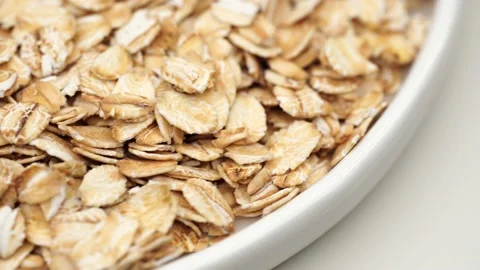 Uncooked oatmeal flakes texture close up Stock Footage 234993389