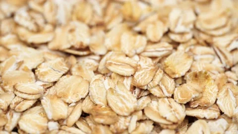 Uncooked oatmeal flakes texture close up Stock Footage 234993438