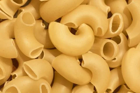 Uncooked pasta background Stock Photos