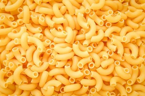 Uncooked pasta cornetti background, texture Stock Photos