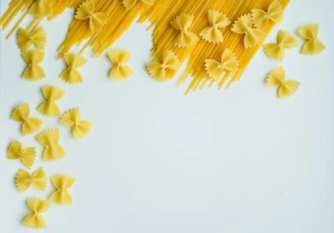 Uncooked pasta spaghetti macaroni isolated on white background Stock Photos