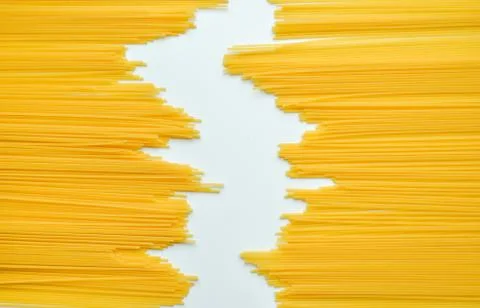 Uncooked pasta spaghetti macaroni isolated on white background Stock Photos