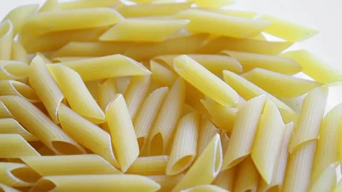 Uncooked penne type pasta from above Stock Footage 150730662
