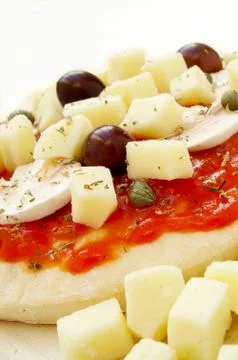 Uncooked pizza base Stock Photos