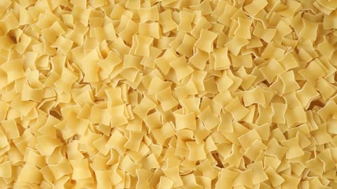 Uncooked raw quadretti pasta background texture Stock Footage 339367038