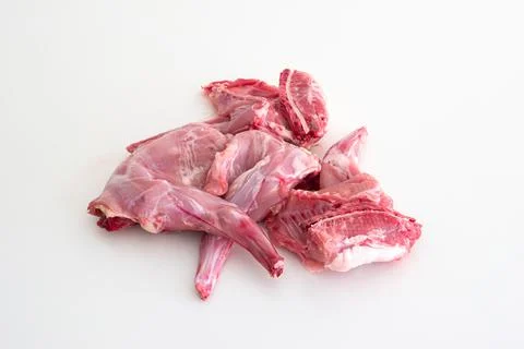 Uncooked raw rabbit or hare legs. Close up top view studio shot, no people Photos