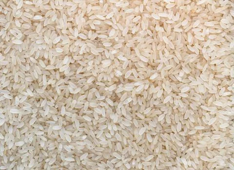 Uncooked rice background Stock Photos
