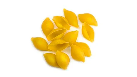 Uncooked shell pasta on white background. View from the top. Stock Photos
