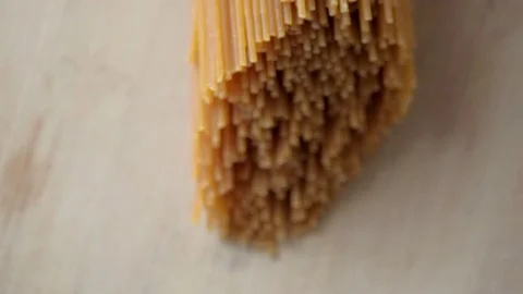 Uncooked spaghetti pasta on kitchen table. Stock Footage 72241511