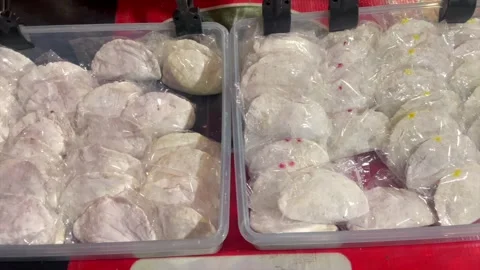 Uncooked stuffed cireng snacks displayed in plastic containers Stock-Footage 341897967