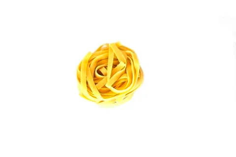Uncooked tagliatelle. Isolated Stock Photos