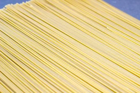 Uncooked thin spaghetti as the background, copyspace. Foto stock