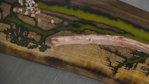 Uncooked tomahawk beef steak on brown, a bone-in variety of ribeye steak, close Vídeos de archivo 117442173