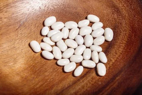 Uncooked white beans closeup macro Stock Photos