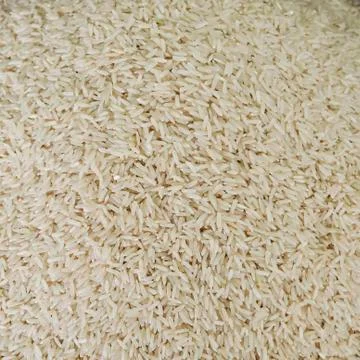 Uncooked white rice background Stock Photos