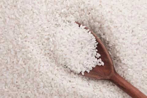 Uncooked white rice background Stock Photos