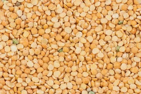 Uncooked yellow peas as background Stock Photos