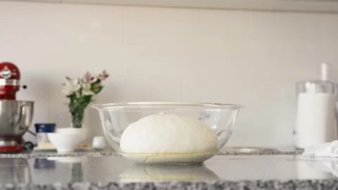 Uncovering Risen Bread Dough: Cook Removes Film Cover - 4K, Cinematic Aesthetic 動画素材 246947662
