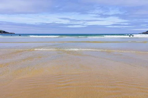 Uncrowded Crantock beach in Cornwall on a sunny summer morning. Stock Photos