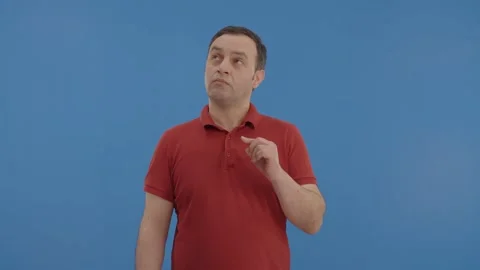 The undecided man looking to his right and left is happy choosing someone. Stock Footage 148260850