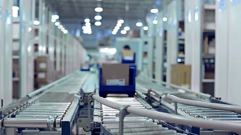#undefined 	Cardboard boxes are moving on a transporter of a packaging line Stock Footage