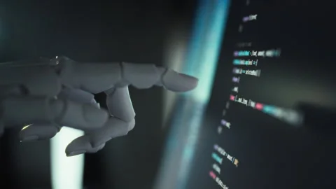 Under AI guidance a humanoid robot generates complex code using a sophistica Stock Footage 336570886