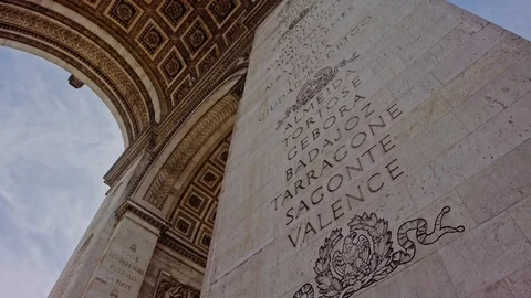 Under the Arc de Triomphe tilt up slow motion Stock Footage 124403481