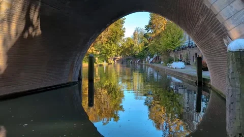 From under an arch bridge a view of the canal in Utrecht. Stock Footage 326183912
